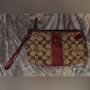 Coach Signature Canvas wristlet in khaki and red